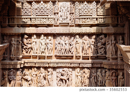 Ancient bas-relief at temple in Khajuraho, India. Ancient bas-relief at temple in Khajuraho, India. 35602553