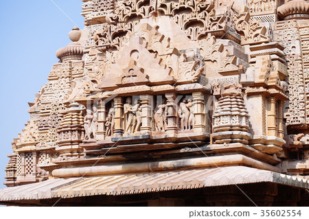 Ancient bas-relief at temple in Khajuraho, India. Ancient bas-relief at temple in Khajuraho, India. 35602554