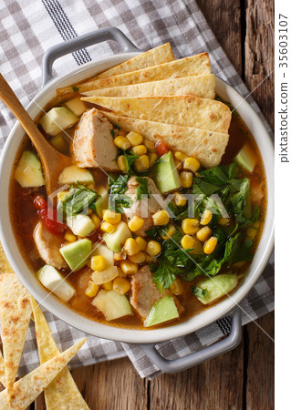spicy tortilla soup with chicken, cilantro, tomato spicy tortilla soup with chicken, cilantro, tomato 35603107