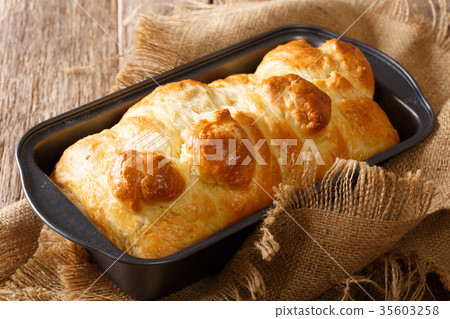 Hot aromatic brioche bread in a baking dish 35603258