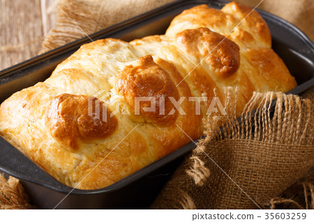 Freshly brioche bread in a baking dish close-up 35603259