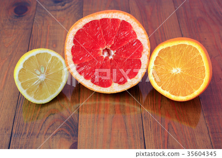 cut grapefruit orange and lemon are reflected cut grapefruit orange and lemon are reflected 35604345