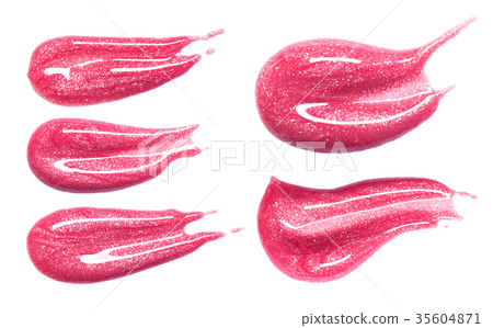 Set of different lip glosses smear isolated on white. Smudged makeup product sample. 35604871