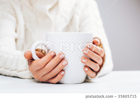 Woman with manicure and cup. 35605715