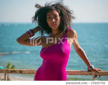 afro woman on sea beach. Sexy girl in swimsuit 35605792