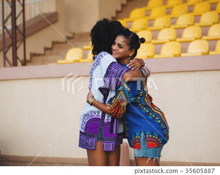 Two afro-american women friends hugging each other 35605887