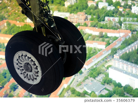 Extended landing gear in the air in flight Extended landing gear in the air in flight 35606379