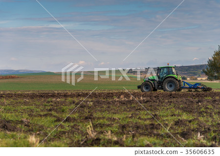 Tractor plowing fields. Tractor plowing fields. 35606635