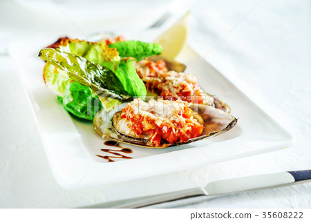 mussels baked with parmesan and herbs mussels baked with parmesan and herbs 35608222