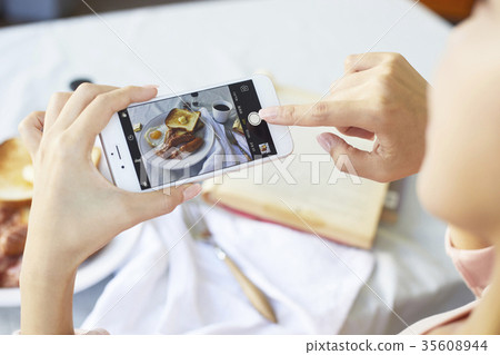 Young woman, cellphone, photo shoot 35608944