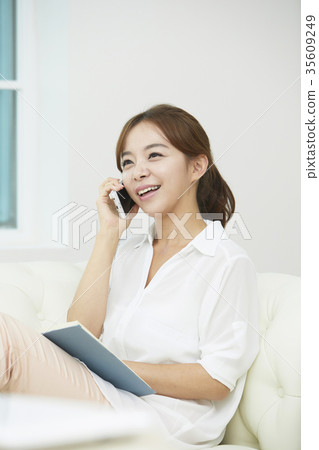 Young woman, cellphone, currency 35609249