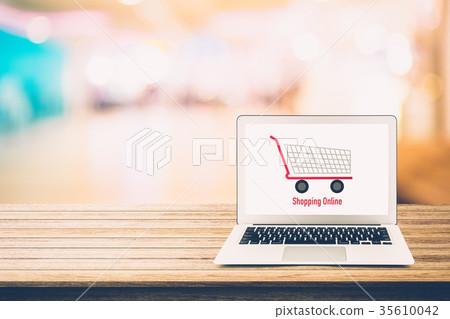 shopping online with labtop, notebook on table top 35610042