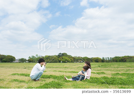 Parent and child playing in the park Parent and child playing in the park 35613699