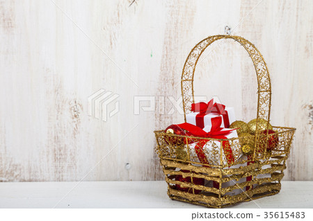 Golden basket with Christmas gifts Golden basket with Christmas gifts 35615483