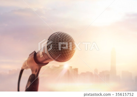Microphone in concert stage on city background 35615752
