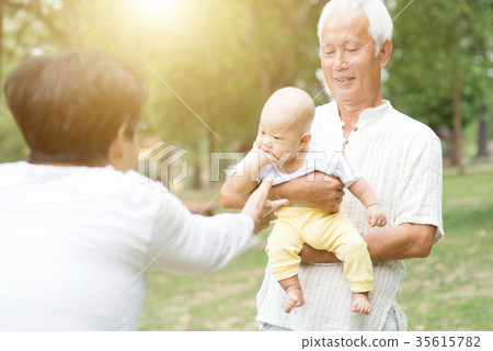 Grandparents and grandchild. Grandparents and grandchild. 35615782