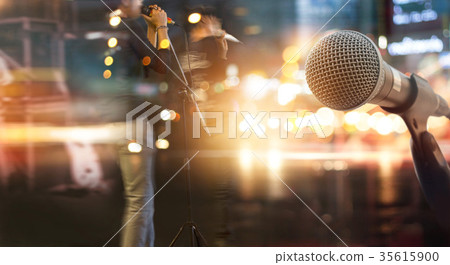 Abstract microphone and musician on stage Abstract microphone and musician on stage 35615900