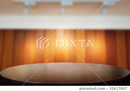 Empty wood table and blurred booked cafe light background. produ Empty wood table and blurred booked cafe light background. produ 35617007