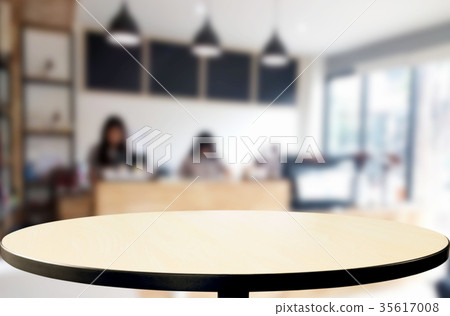 Selected focus empty brown wooden table and Coffee shop blur bac Selected focus empty brown wooden table and Coffee shop blur bac 35617008
