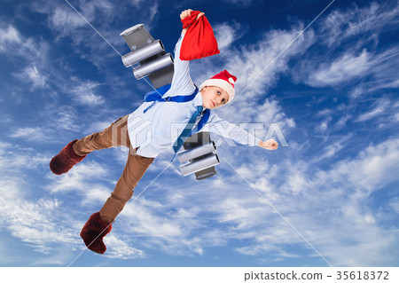 Young Santa Claus flying in the sky with presents 35618372