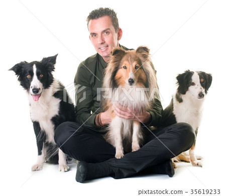 three dogs and man 35619233