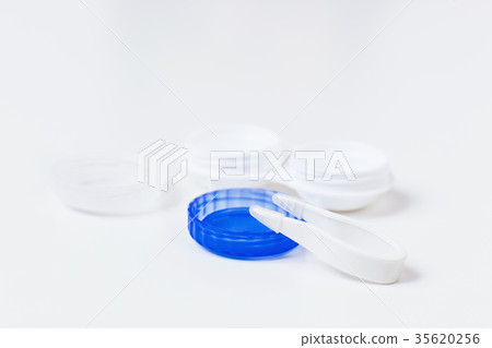 Contact lenses in containers with tweezers. Contact lenses in containers with tweezers. 35620256