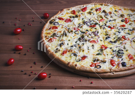 fresh baked pizza with olives and tomatoes fresh baked pizza with olives and tomatoes 35620287