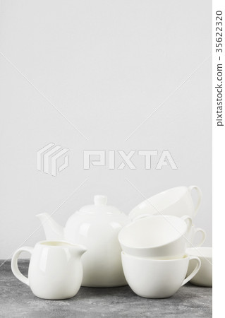 Clean white tableware (teapot, cups, saucers) 35622320