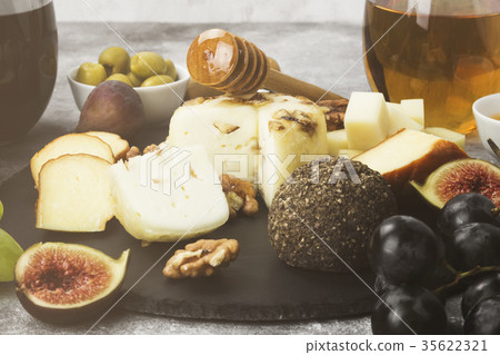 Snacks with wine - various types of cheeses, figs Snacks with wine - various types of cheeses, figs 35622321