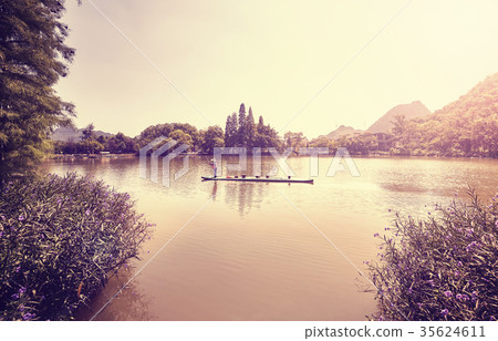 Bamboo raft on a lake in Guilin at sunset, China. Bamboo raft on a lake in Guilin at sunset, China. 35624611