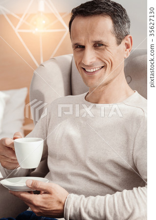 Attractive male person looking at camera Attractive male person looking at camera 35627130