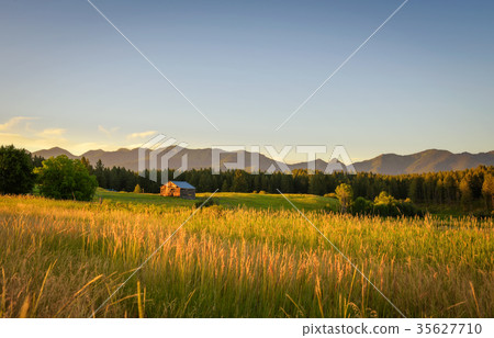 Summer sunset with an old barn in rural Montana Summer sunset with an old barn in rural Montana 35627710