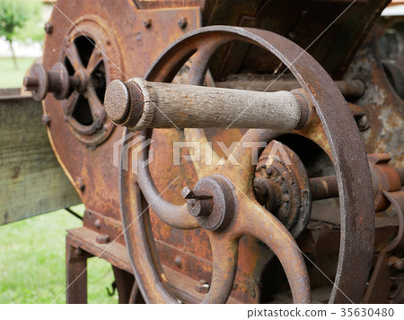 Vintage grain grinder machine. Vintage grain grinder machine. 35630480