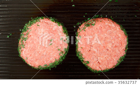 Two fresh beefsteaks fry on a grill Two fresh beefsteaks fry on a grill 35632737