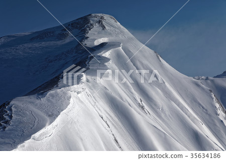 Snow and smoke rising northern alps, Kashima Sugagatake ridge line 35634186