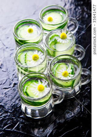 Cucumber water in six little mason glass jar 35641477