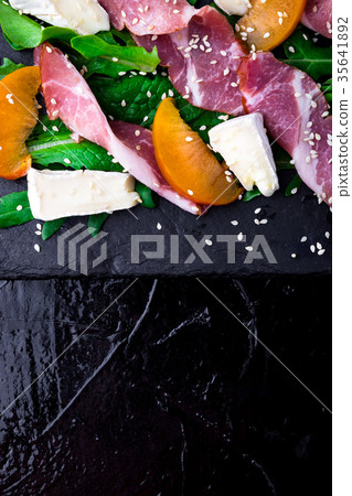 Salad with ham jamon serrano, camembert 35641892