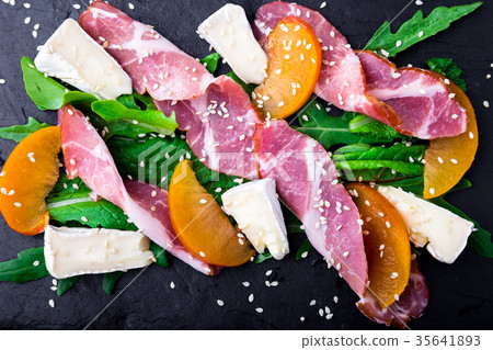 Salad with ham jamon serrano, camembert 35641893