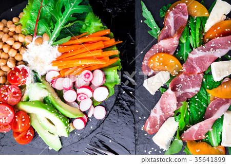 Two different salads om black stone slate. Vegan Two different salads om black stone slate. Vegan 35641899