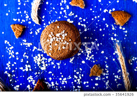 Oatmeal cookies on blue wooden background Oatmeal cookies on blue wooden background 35641926