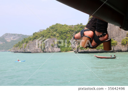 Feet and shoes of women on the tourboat Feet and shoes of women on the tourboat 35642496