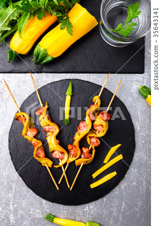 Zucchini and chicken kebab on wooden Zucchini and chicken kebab on wooden 35643141