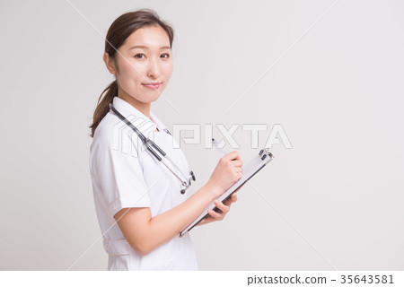 Nurse holding a medical record 35643581
