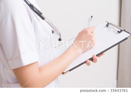 Nurse holding a medical record 35643761