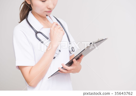 Nurse holding a medical record Nurse holding a medical record 35643762