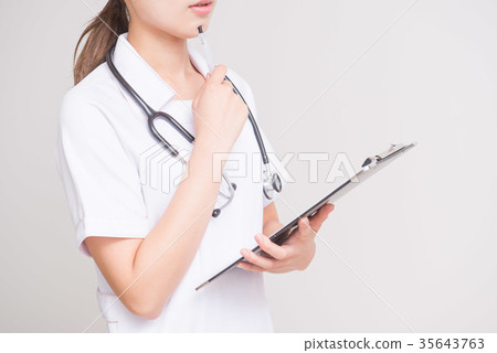 Nurse holding a medical record Nurse holding a medical record 35643763