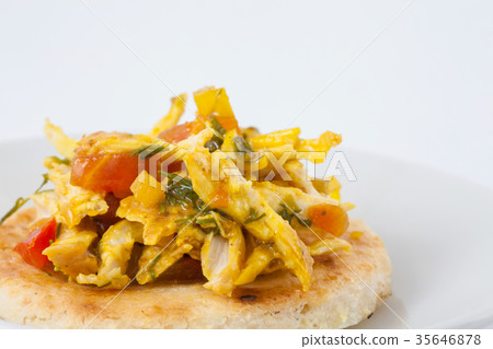 Colombian arepa topped with chicken breast 35646878