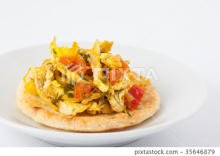 Colombian arepa topped with chicken breast 35646879