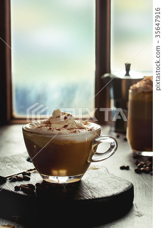 Glass of pumpkin latte Glass of pumpkin latte 35647916