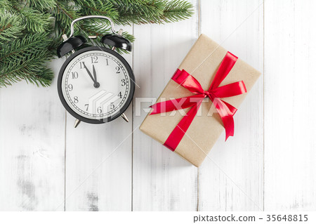 Christmas fir tree branches with gift box Christmas fir tree branches with gift box 35648815